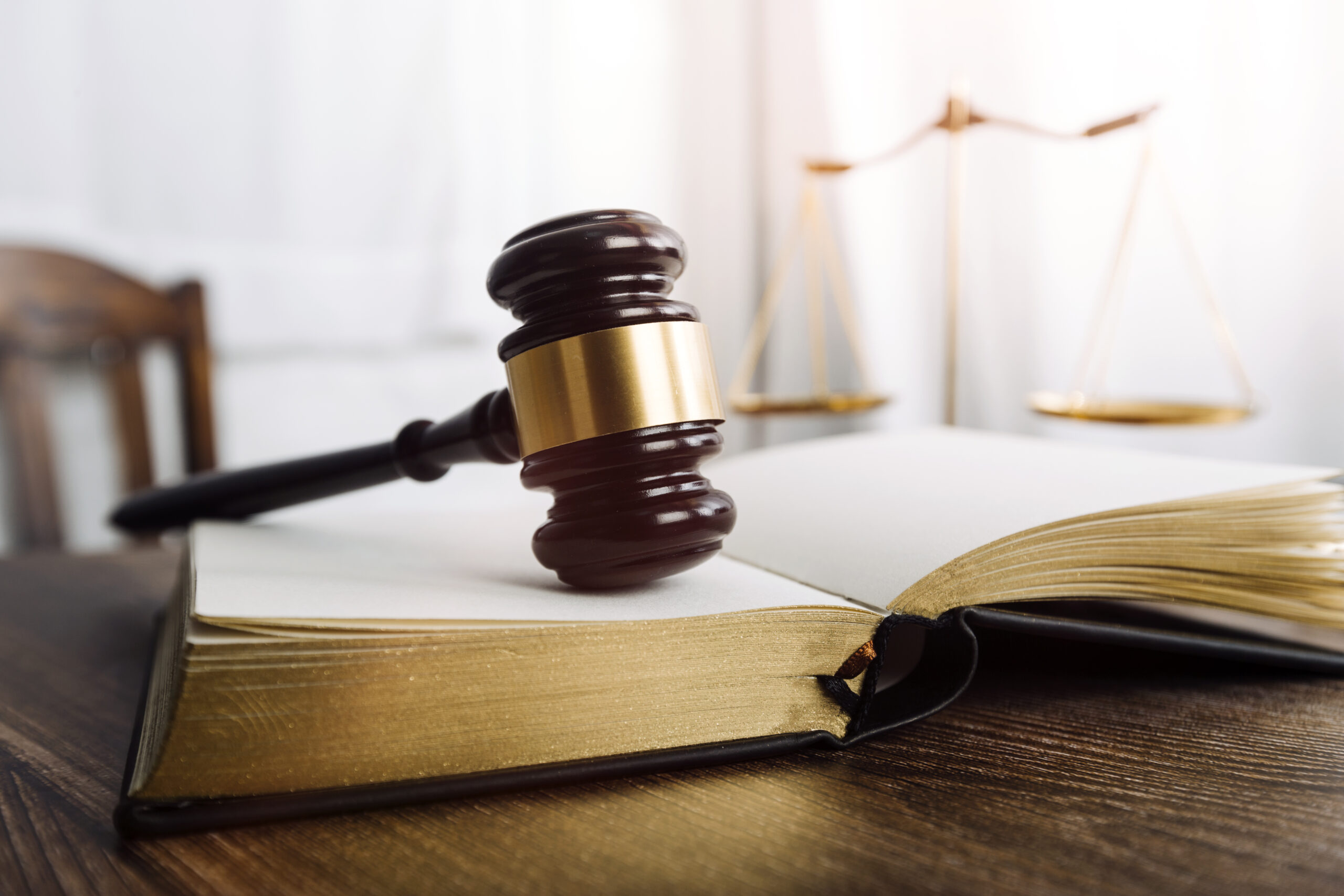 Justice and law concept.Male judge in a courtroom with the gavel