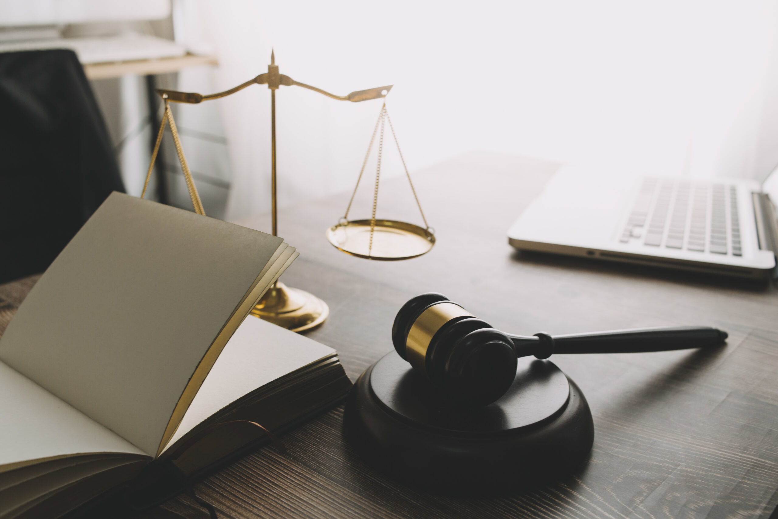 justice and law concept.Male judge in a courtroom on wooden tabl