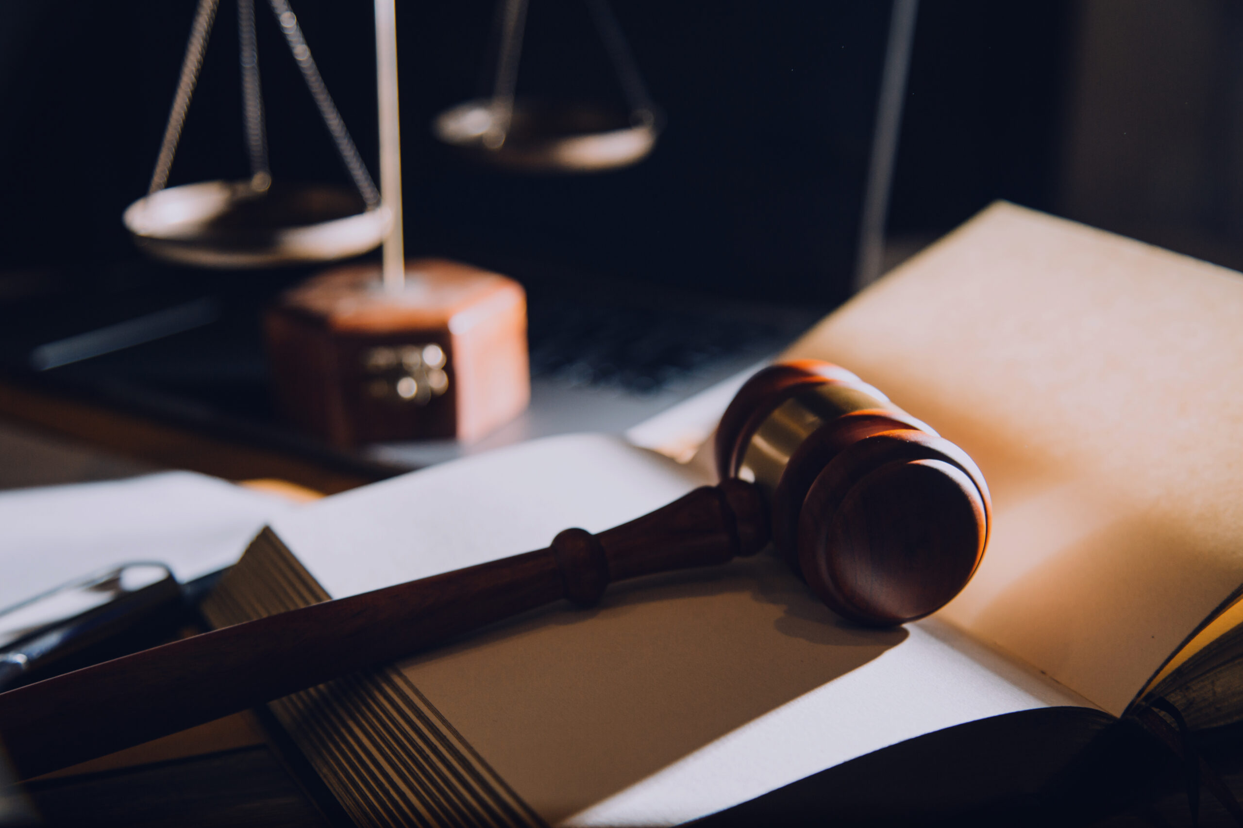 law legal technology concept. judge gavel on computer with scale