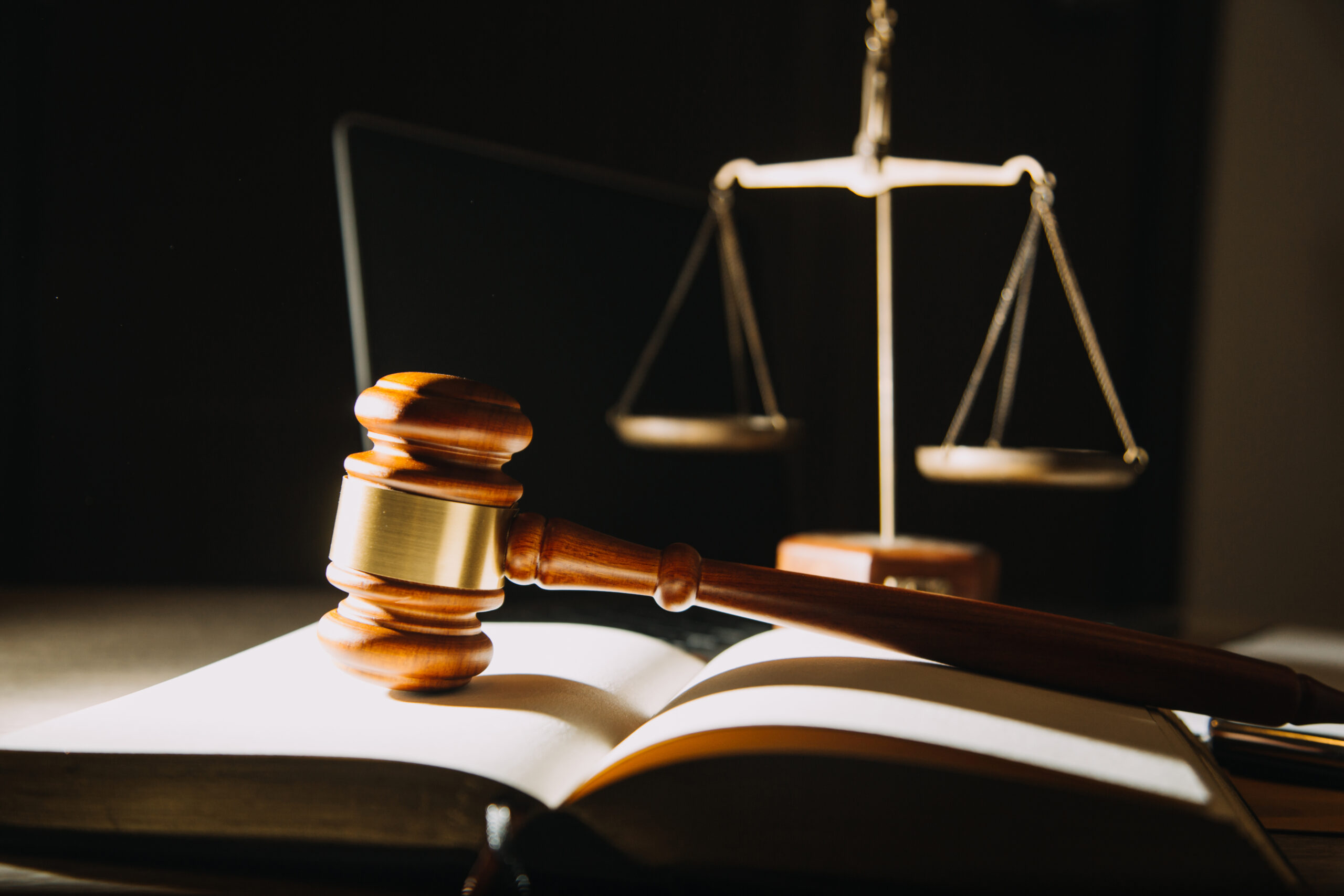 law legal technology concept. judge gavel on computer with scale