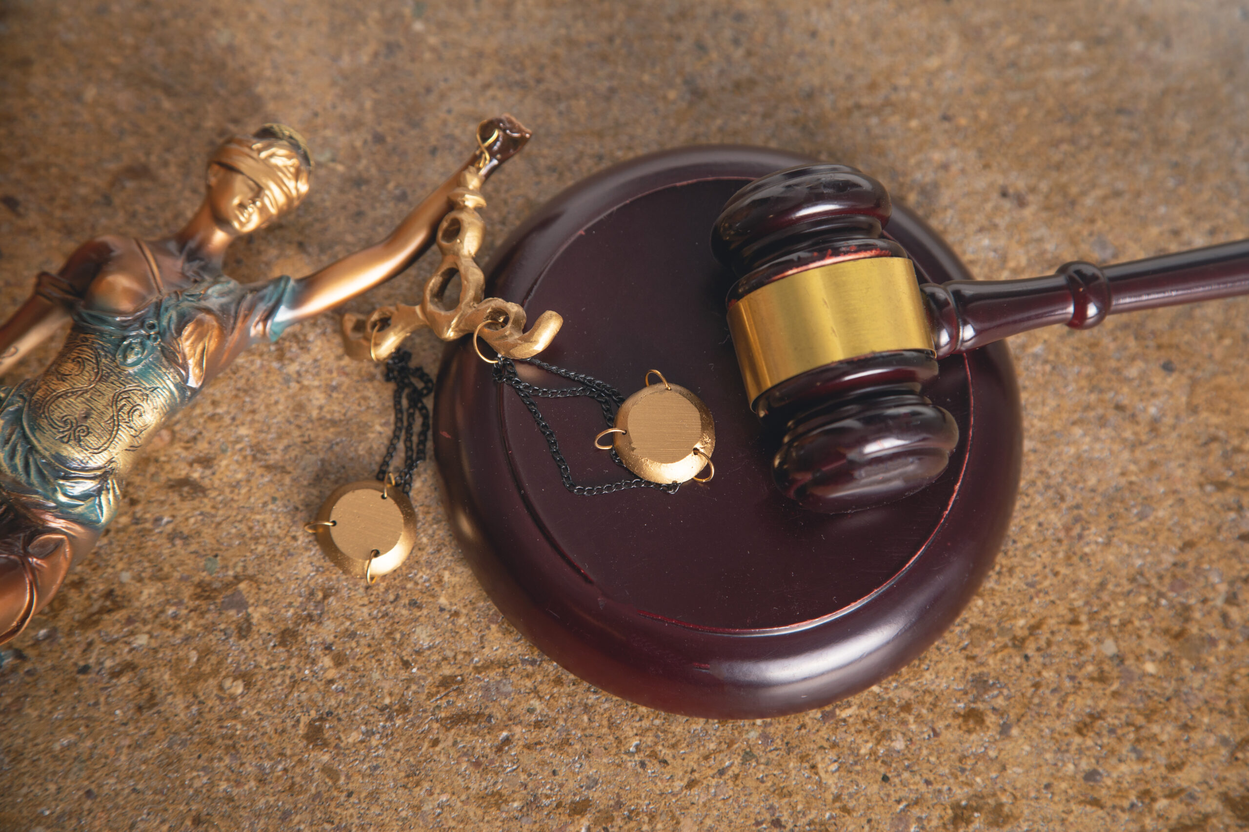 Lady Justice statue and judge gavel.